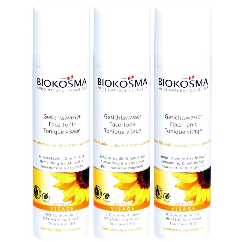 Drei Flaschen Gesichtswasser. Weiß, mit gelbem Etikett und Sonnenblumenmotiv. Text: Biokosma, Gesichtswasser, Face Tonic, Tonique visage.