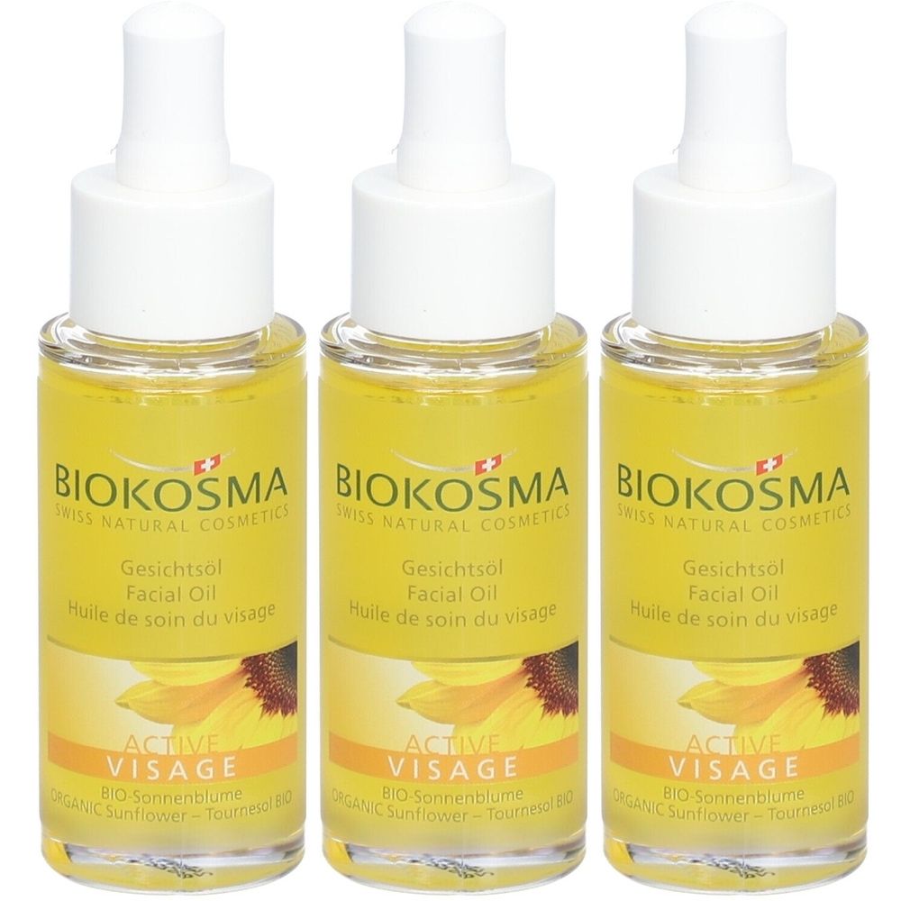 Trois flacons d'huile pour le visage BIOKOSMA avec bouchon blanc et contenu jaune. Inscription : Active Visage, Huile de soin du visage.