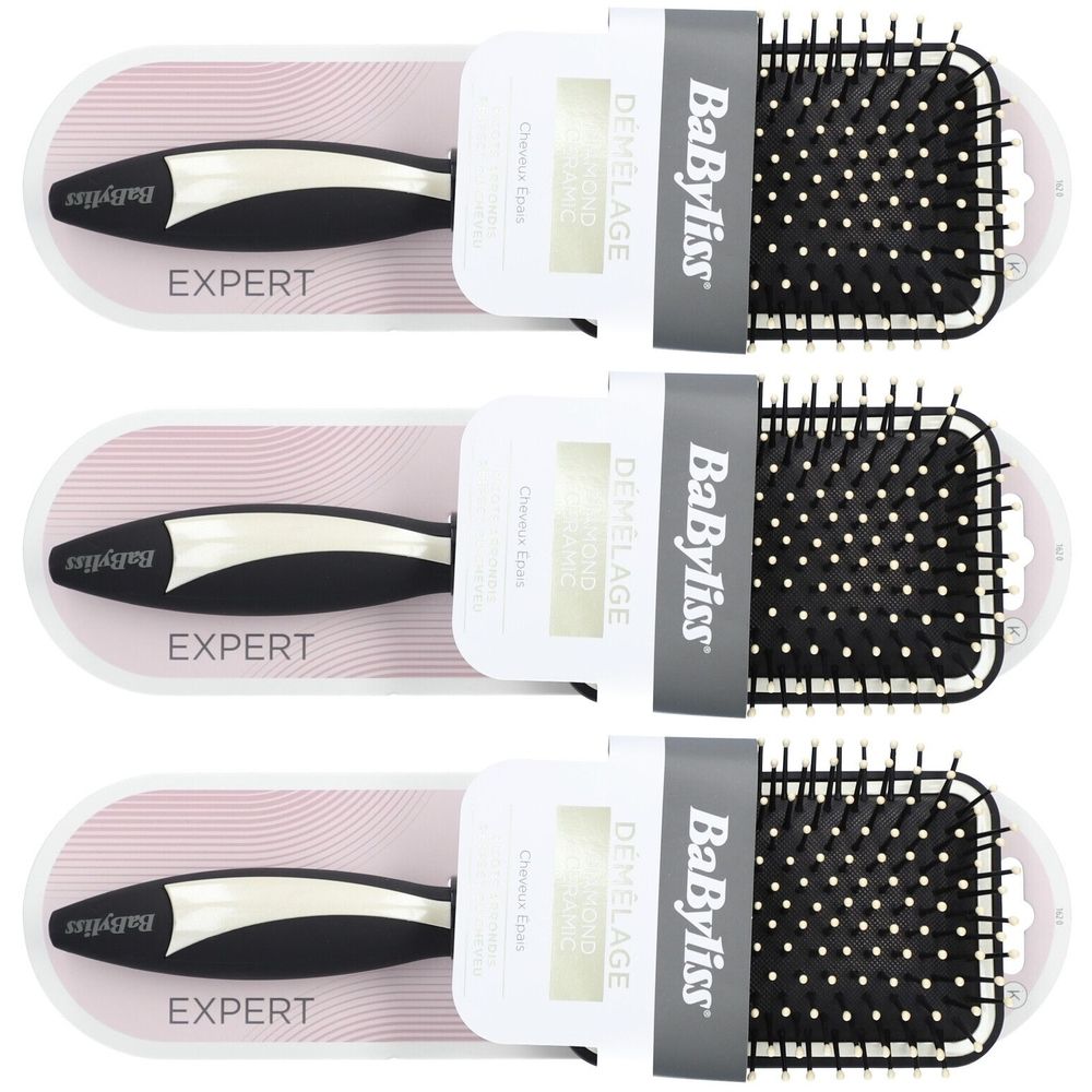 Drei Haarbürsten in Verpackung. Schwarzer Griff, grauer Bürstenkopf mit weißen Noppen. Marke BaByliss, Schriftzug EXPERT.