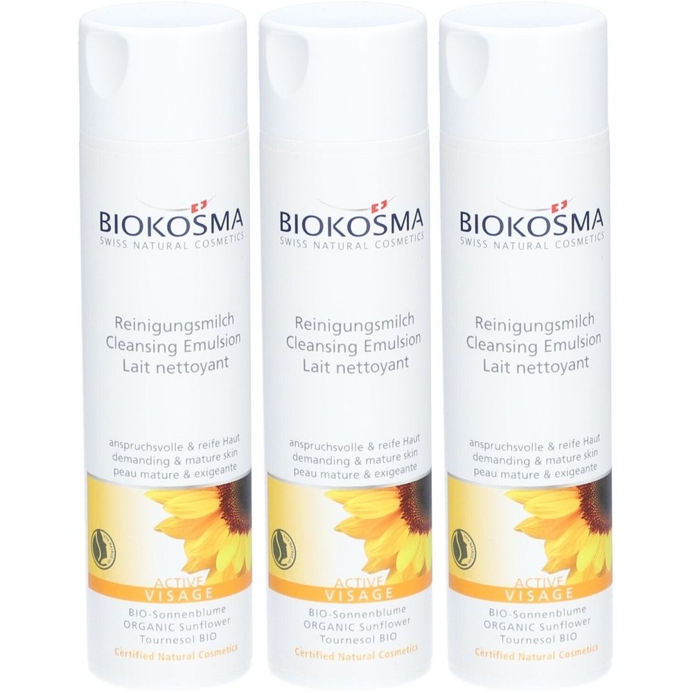 Trois flacons blancs avec étiquettes. Inscription: BIOKOSMA, Reinigungsmilch, Cleansing Emulsion, Lait nettoyant. Motif tournesol.