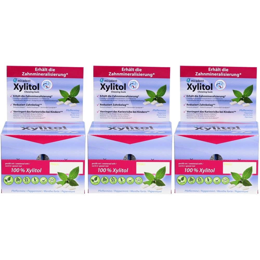 Mehrere Packungen Xylitol Kaugummi, mit Text und Abbildungen von Minzblättern. Oben steht "Erhält die Zahnmineralisierung".