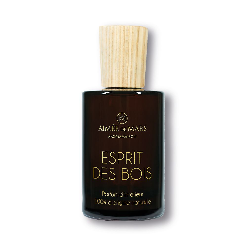 Braune Glasflasche mit Holzverschluss. Aufschrift: Esprit des Bois, Parfum d'intérieur, 100% d'origine naturelle.