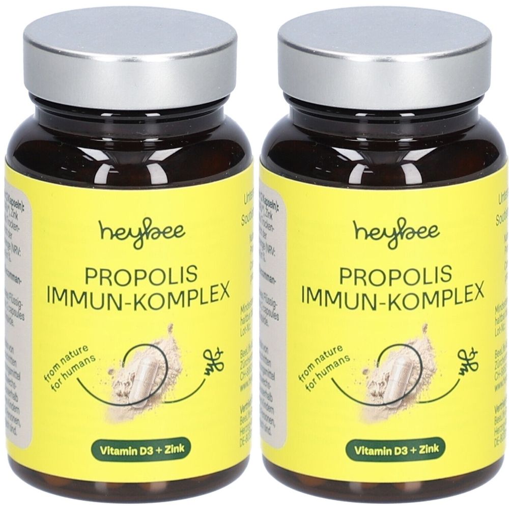 Zwei Flaschen mit gelben Etiketten. Aufschrift: heybee PROPOLIS IMMUN-KOMPLEX, Vitamin D3 + Zink. Braune Glasflaschen mit silbernen Deckeln.