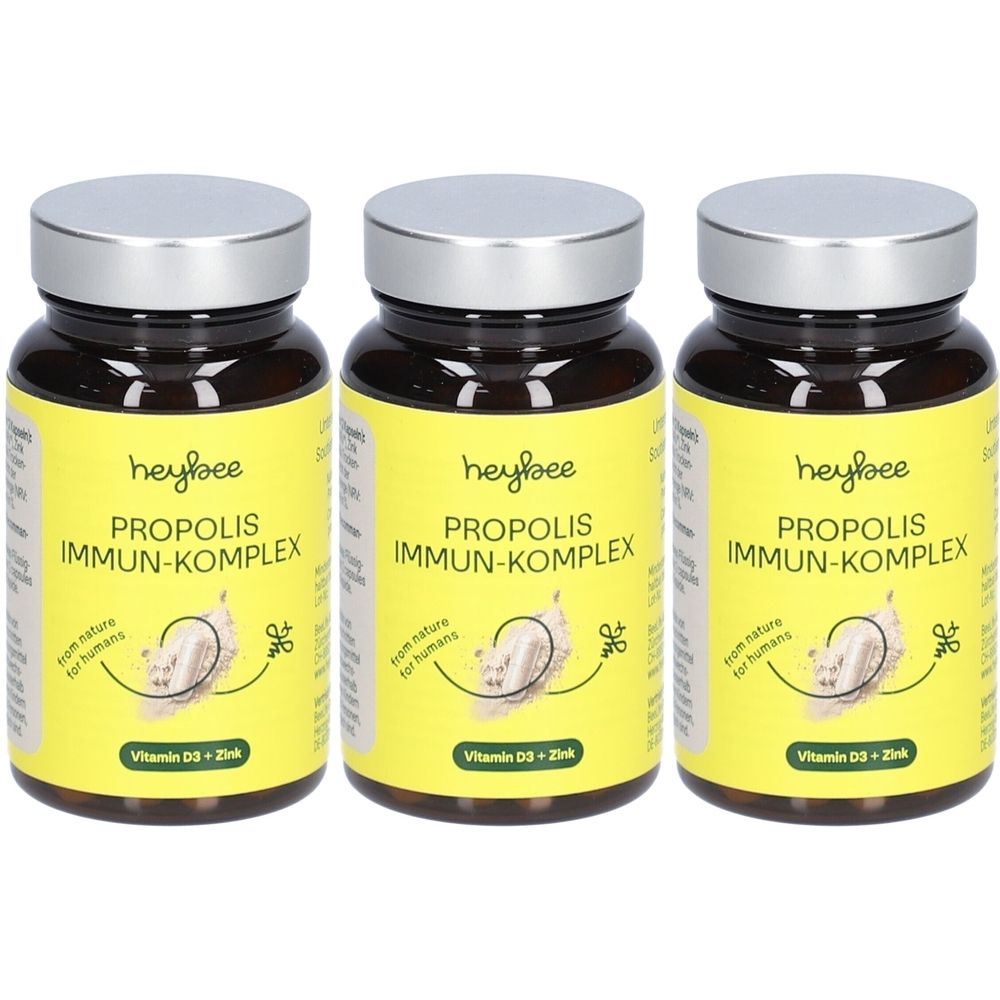 Trois flacons en verre brun avec des couvercles argentés. Les étiquettes jaunes indiquent "heybee PROPOLIS IMMUN-KOMPLEX".