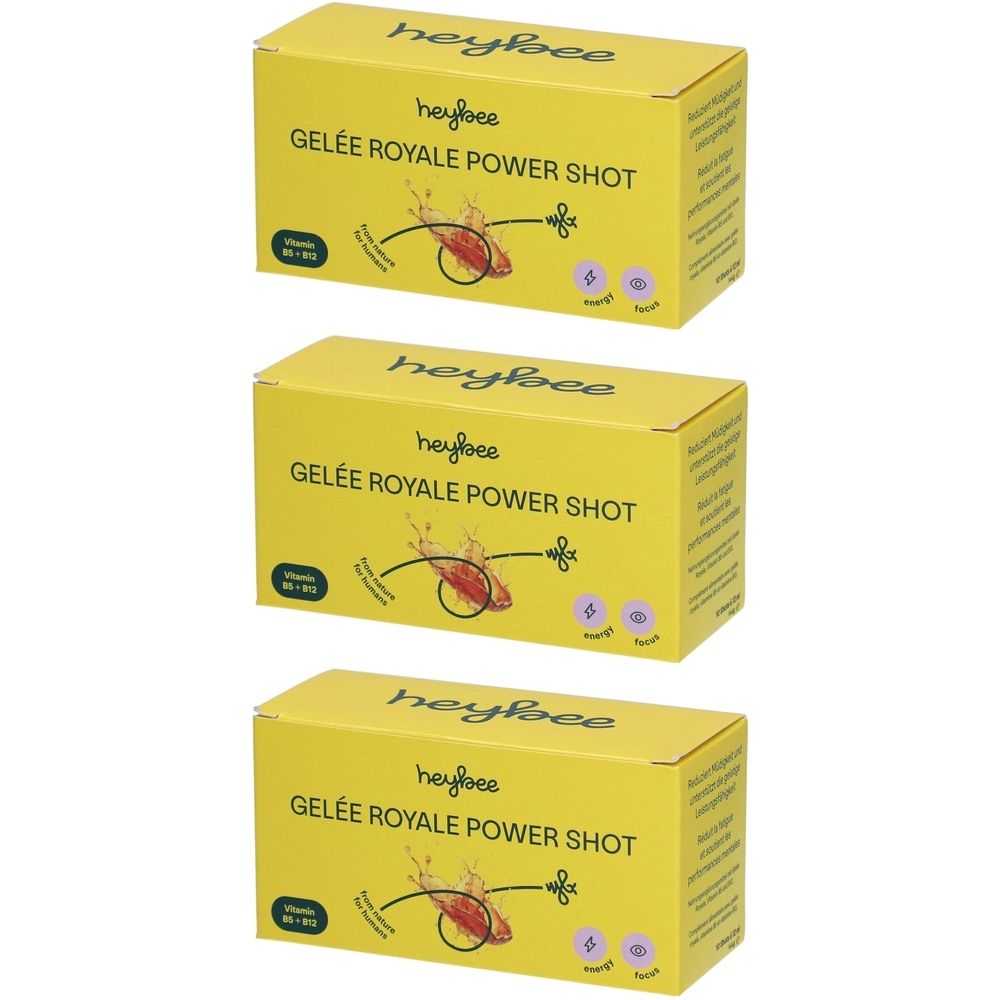 Drei gelbe Kartons mit "HEYBEE GELÉE ROYALE POWER SHOT" Aufschrift. Aufdrucke: Vitamin B12, Energie, Fokus.