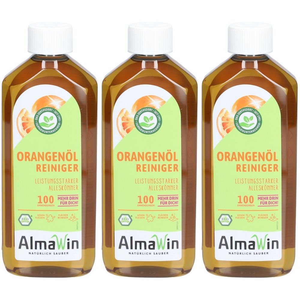 Drei Flaschen mit Etiketten. Aufschrift: Orangenöl Reiniger. Marke: AlmaWin. Grün-orangenes Etikett mit Logo und Text.