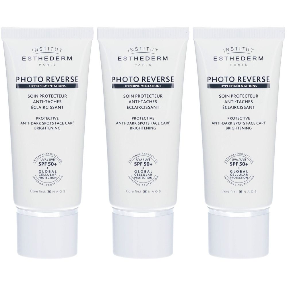 Drei Tuben Institut Esthederm Photo Reverse SPF 50+. Weiße Tuben mit Schriftzug und Logo. Aufschrift: Photo Reverse, SPF 50+.