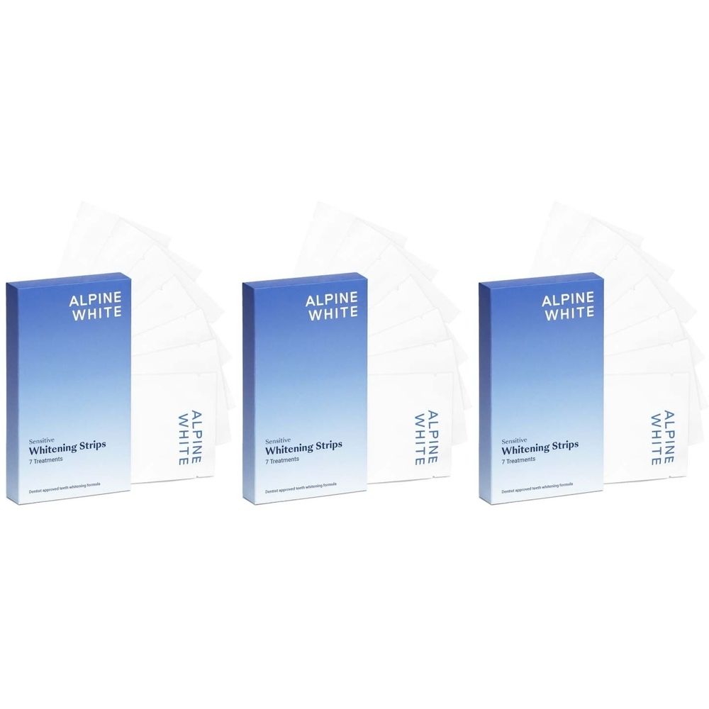 Trois boîtes "ALPINE WHITE Whitening Strips" et des bandes transparentes. Sur les boîtes, on lit "Whitening Strips".