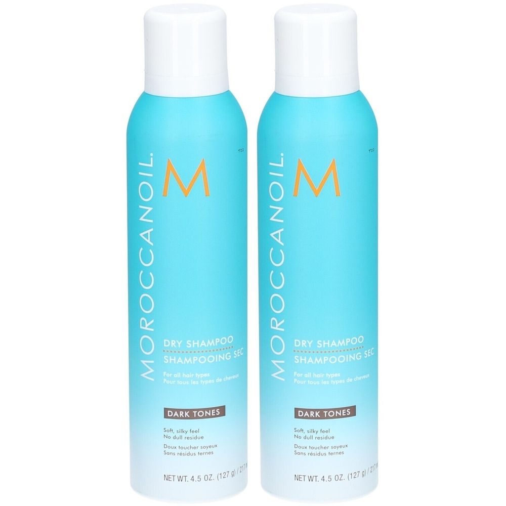 Zwei Flaschen Moroccanoil Trockenshampoo für dunkle Töne. Türkisblaue Flaschen mit weißem Deckel. Produktname und Logo deutlich sichtbar.