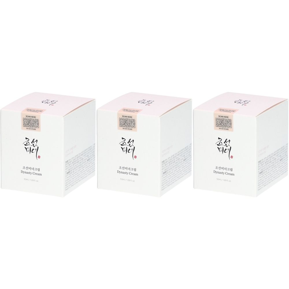 Drei quadratische, weiße Produktverpackungen. Auf jeder Verpackung sind Schriftzeichen und der Schriftzug "Dynasty Cream" zu sehen.