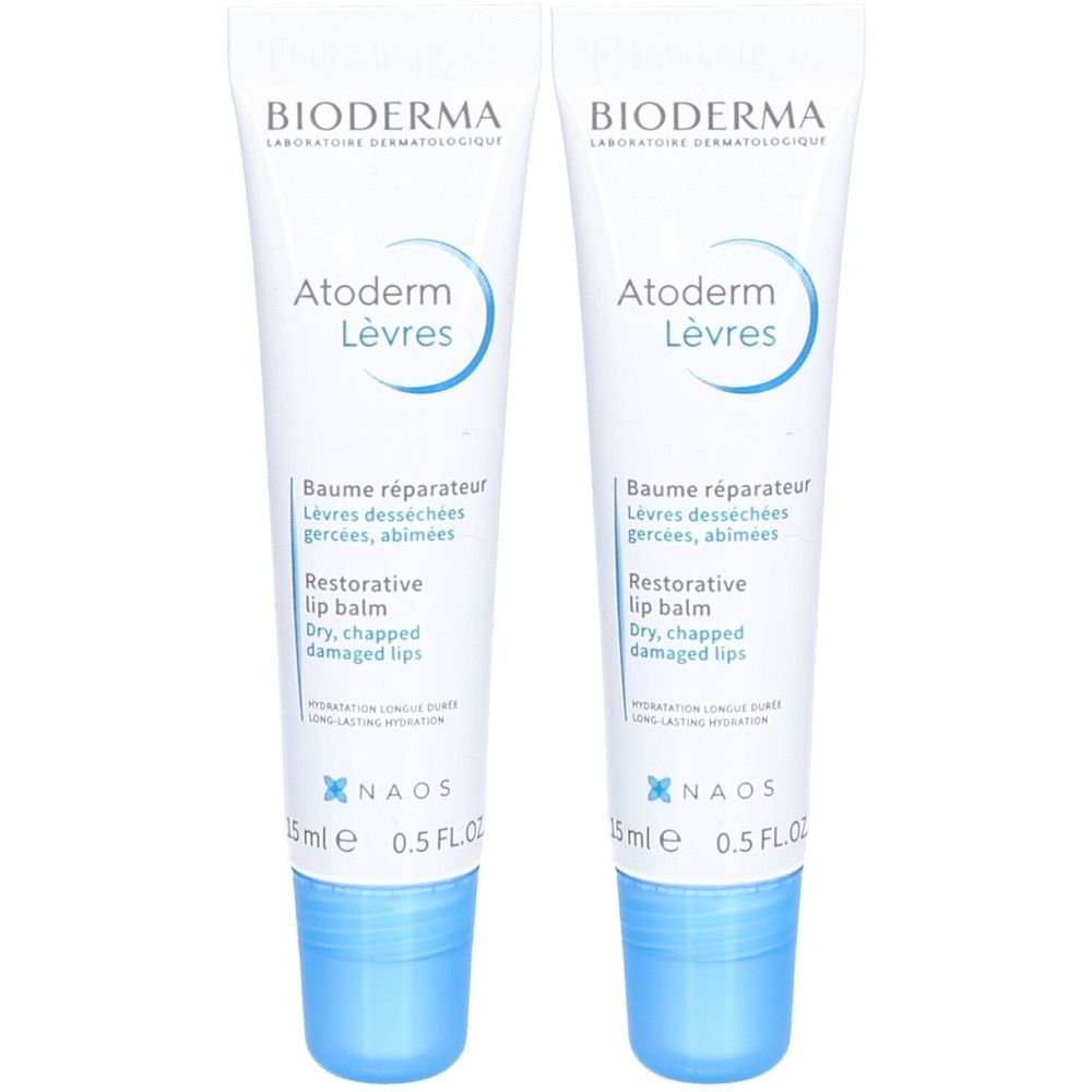 Zwei Tuben Lippenbalsam. Marke BIODERMA. Produktname: Atoderm Lèvres. Text: Baume réparateur, Restorative lip balm. Blaue Kappe, weiße Tube.