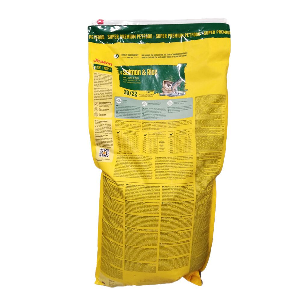 Rückseite des gelben Beutels. Aufschrift: Josera Salmon & Rice. Text und Tabellen. Grün-weiße Details.