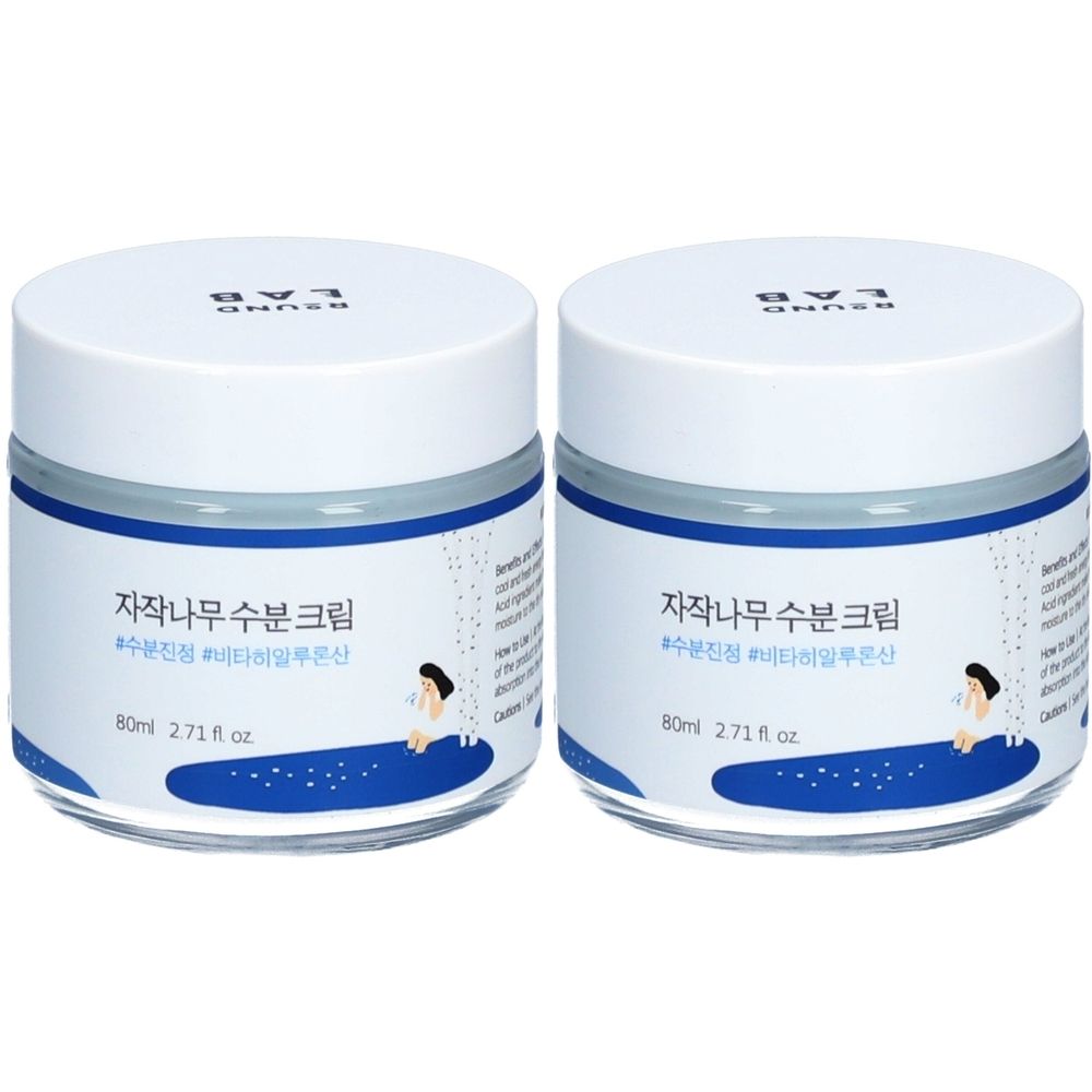 Zwei runde Tiegel mit weißem Deckel und blauem Rand. Auf den Etiketten steht koreanischer Text und "80ml 2.71 fl oz".