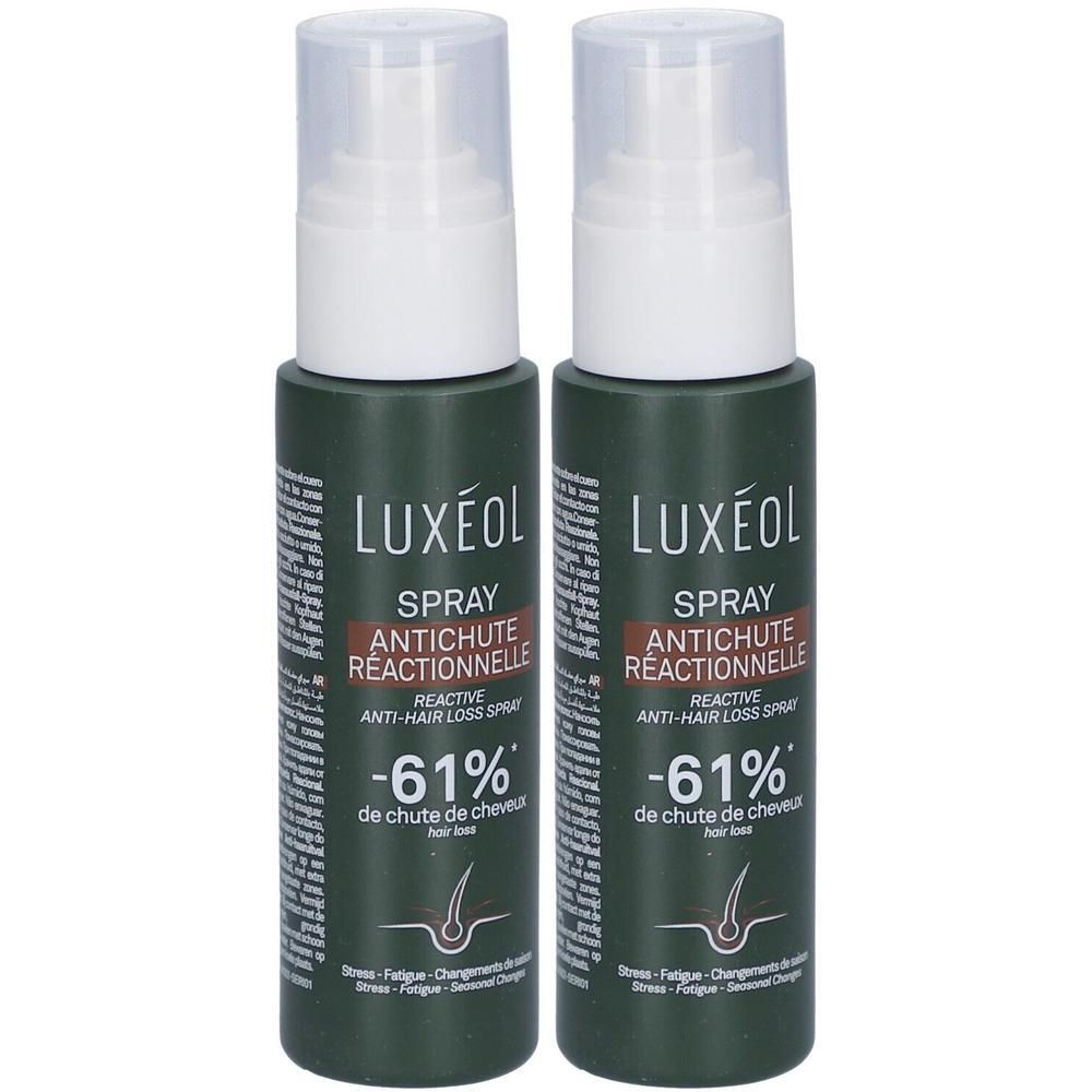 Twee flessen LUXEOL Spray reactieve haaruitval. Donkergroene flessen met witte pompdispenser.