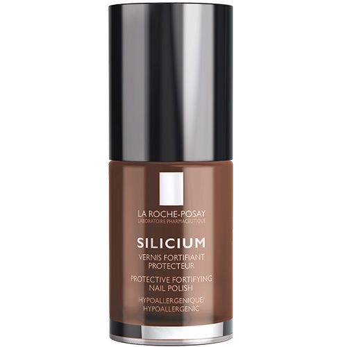 Nagellackflasche, braune Farbe. Silberfarbener Deckel. Aufschrift: SILICIUM, Vernis Fortifiant Protecteur, Protective Fortifying Nail Polish.