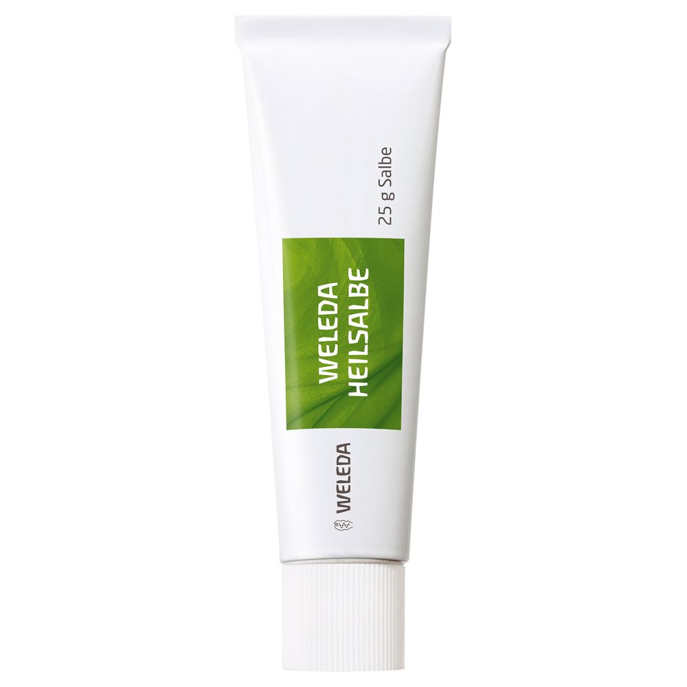 Weiße Tube mit grüner Aufschrift. "Weleda Heilsalbe" und "25 g Salbe".