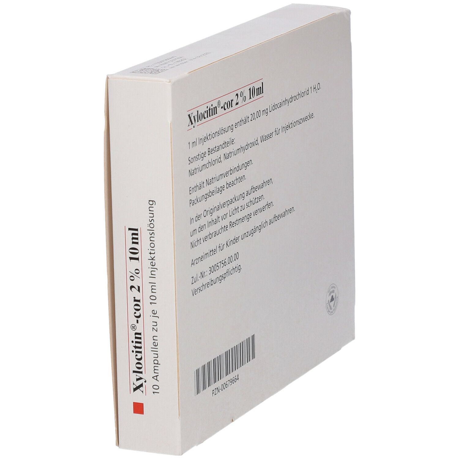 Schräg stehende Verpackung von Xylocitin-cor 2% 10 ml. Rückseite mit Text und Barcode.