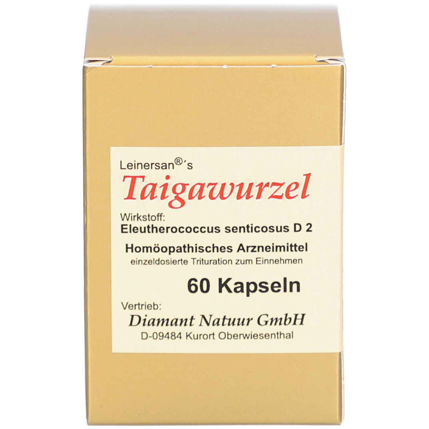 Karton mit Kapseln. Aufschrift: Taigawurzel, 60 Kapseln. Gelbes Etikett mit Produktinformationen.