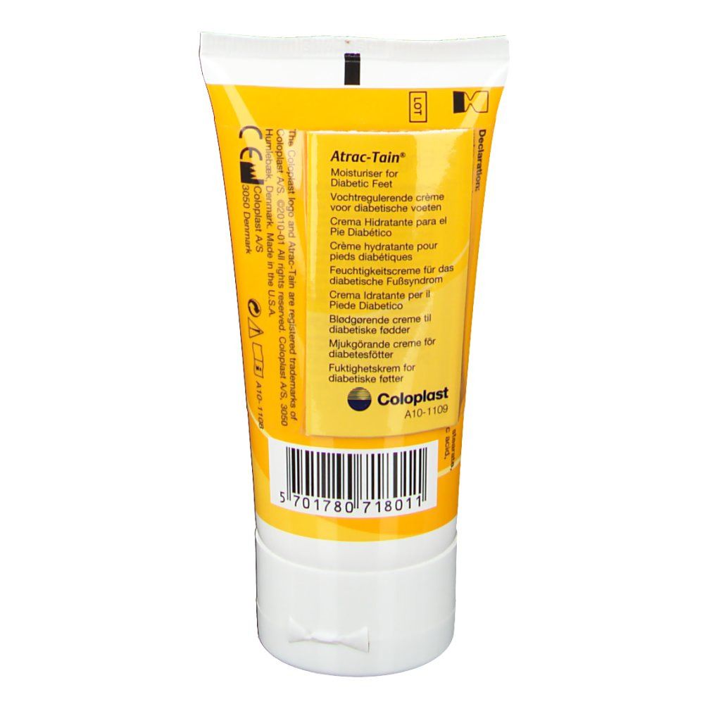 Rückseite der Creme-Tube, gelb-weiß. Aufschrift: Atrac-Tain, Coloplast. Barcode und Text in mehreren Sprachen.