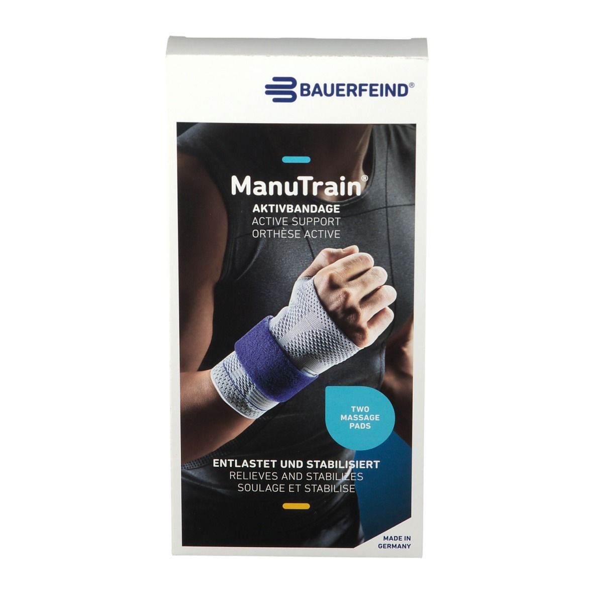 Verpackung mit Handgelenkbandage. Marke: Manutrain. Aufdruck: Aktivbandage, zwei Massagepads. Farbe: Weiß, Blau.