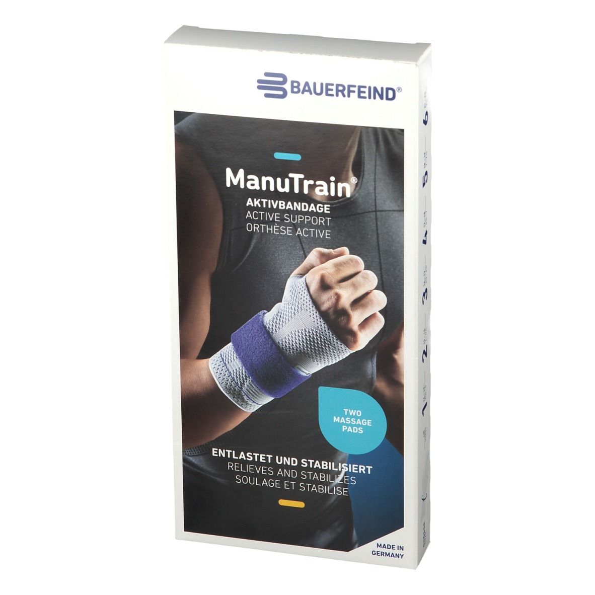 Verpackung mit Handgelenkbandage. Marke: Manutrain. Aufdruck: Aktivbandage, zwei Massagepads. Farbe: Weiß, Blau.