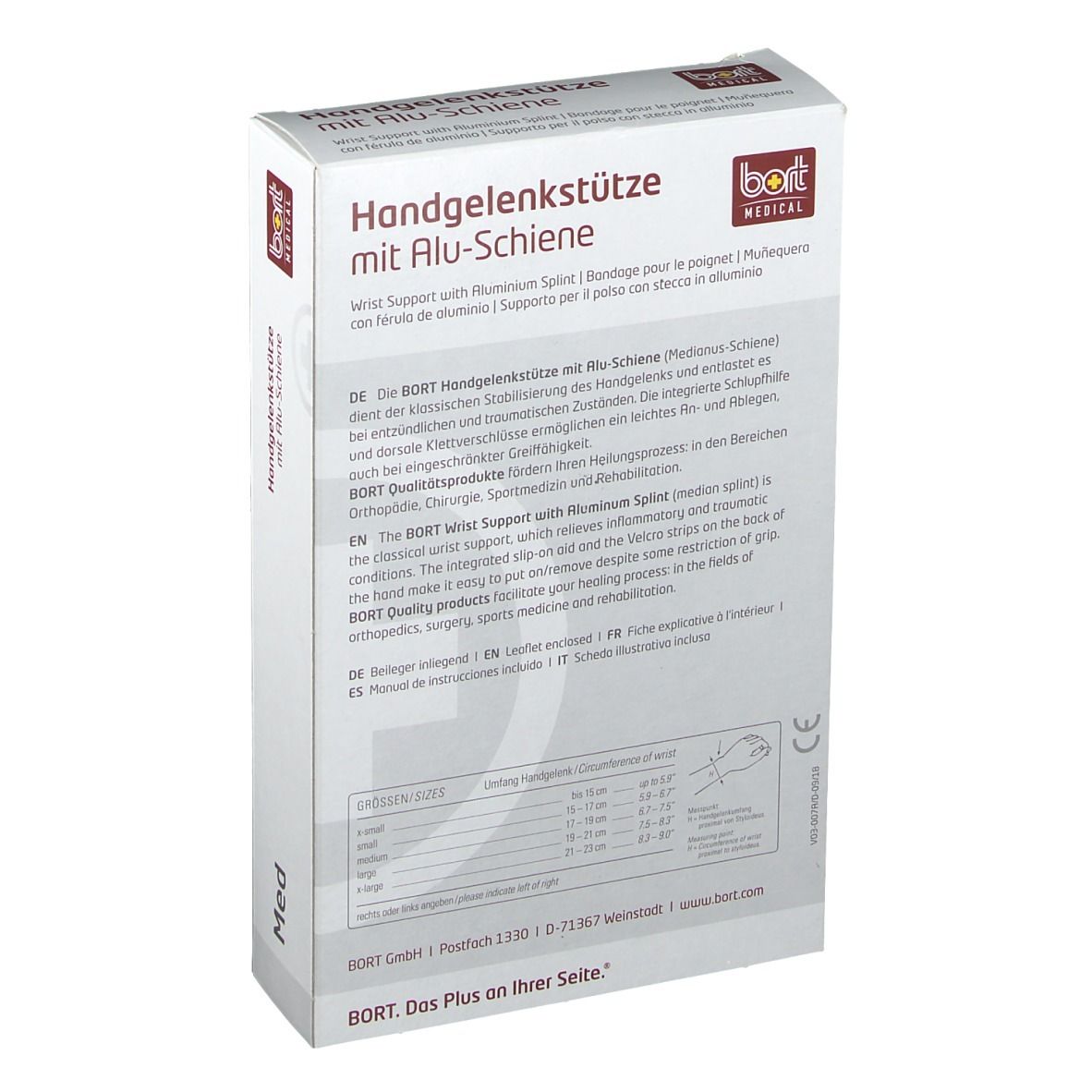 Rückseite der Verpackung der Handgelenkstütze mit Alu-Schiene. Text in Deutsch, Englisch, Französisch und Italienisch. Größentabelle.