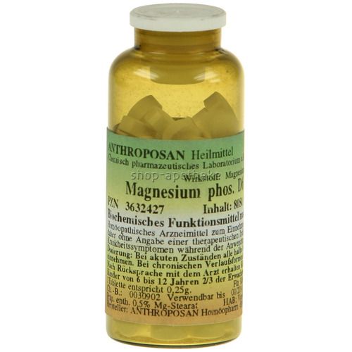 Braune Glasflasche mit weißen Deckel. Etikett mit Text: Magnesium phos. D6, ANTHROPOSAN Heilmittel. Tabletten sichtbar.