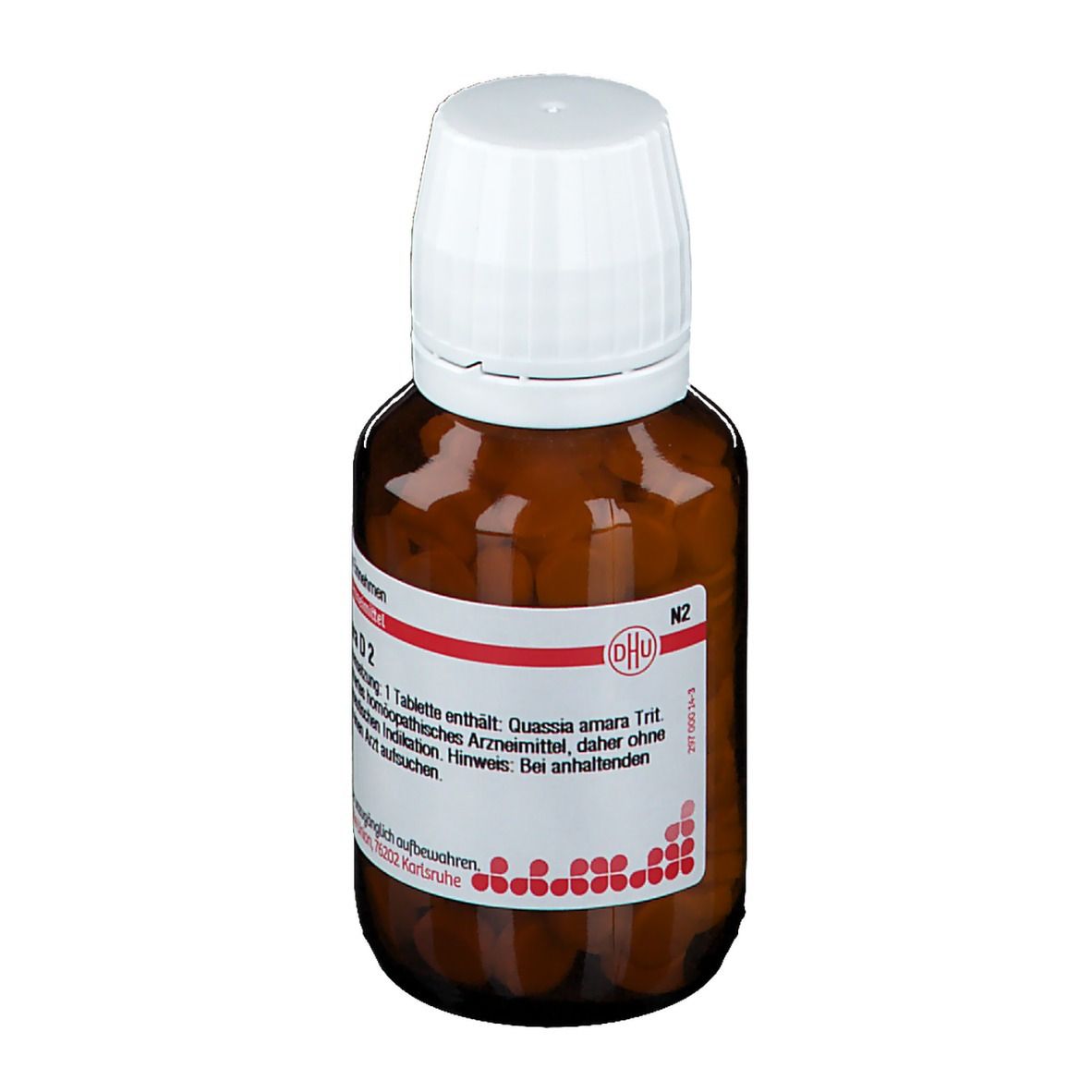 Braune Glasflasche mit weißen Tabletten. Weißer Deckel. Rotes und weißes Etikett mit Text: Quassia amara D2.