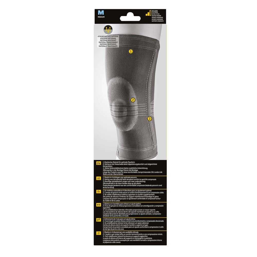 Rückseite der Kniebandage. Graues Material. Nummerierte Bereiche. Texte in mehreren Sprachen. Produktname: Ultra Performance Knie-Bandage.