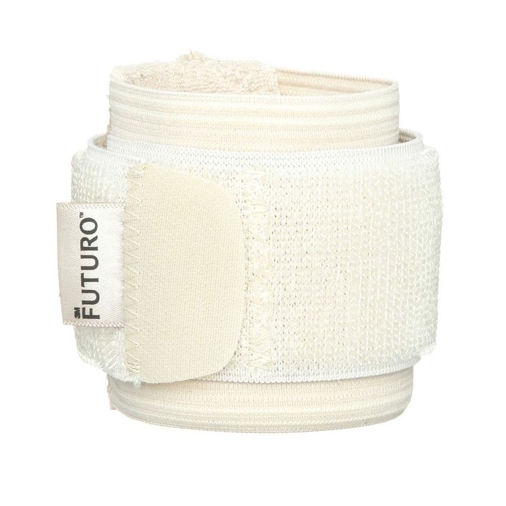 FUTURO Handgelenk-Bandage, beige. Aufgerollt mit Klettverschluss. Produktname auf Etikett.