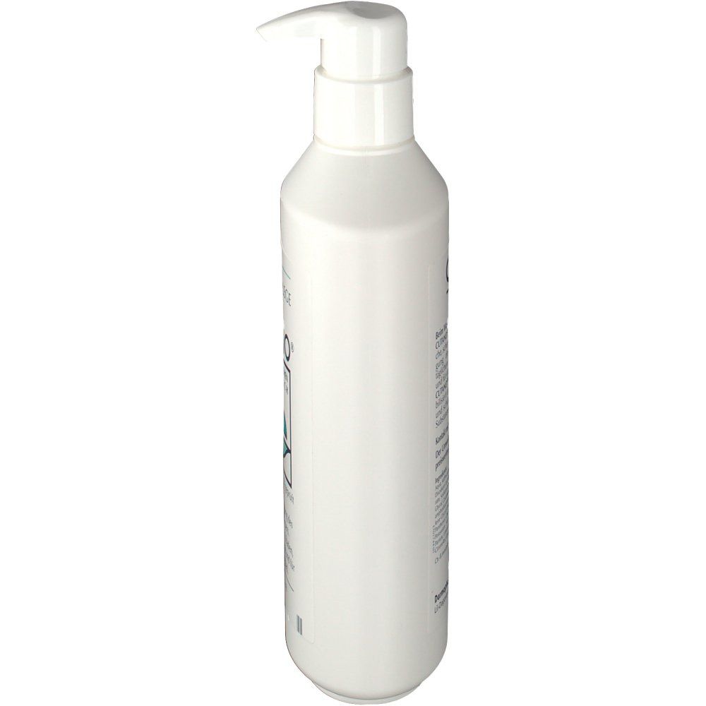 Weiße Flasche mit Dosierkopf. Seitenansicht. Aufschrift nicht lesbar.