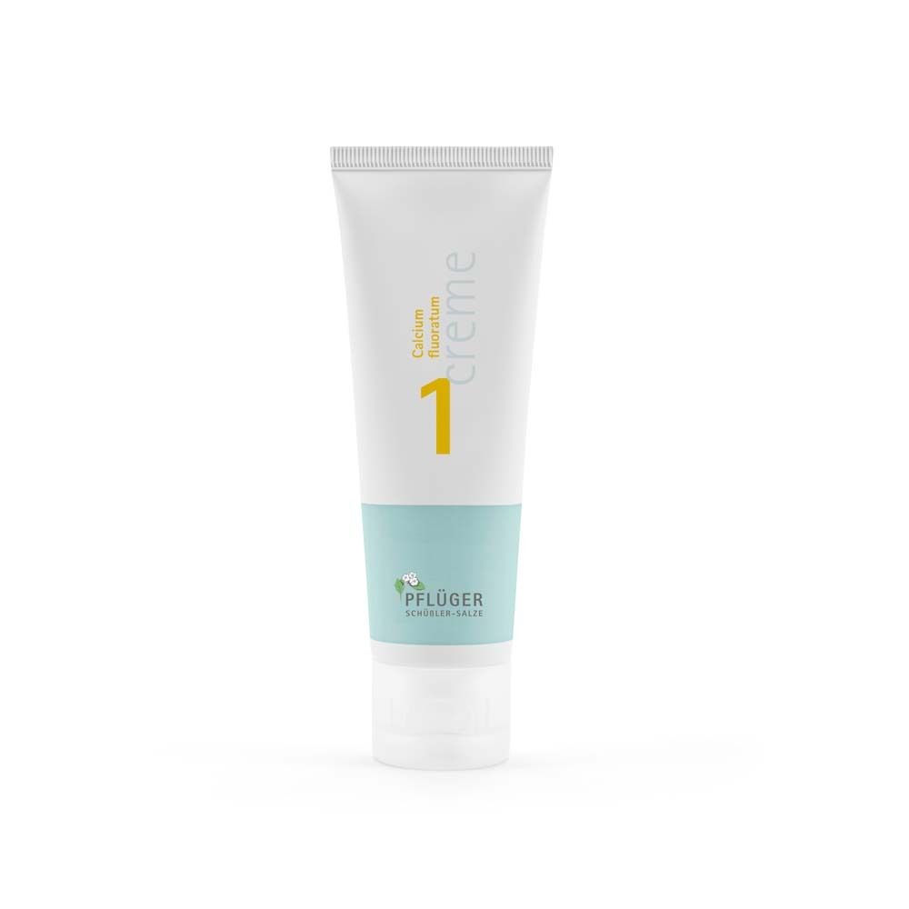 Creme-Tube, weiß mit hellblauem Band. Aufschrift: Calcium fluoratum, Nr. 1, Creme. Marke: Pflüger.