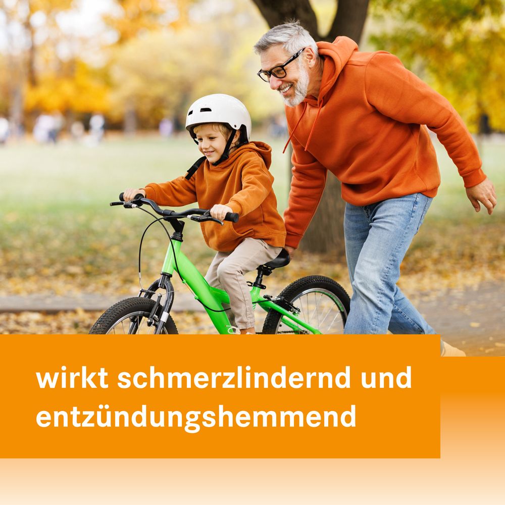 Ein Mann hilft einem Kind beim Fahrradfahren. Text: wirkt schmerzlindernd und entzündungshemmend.