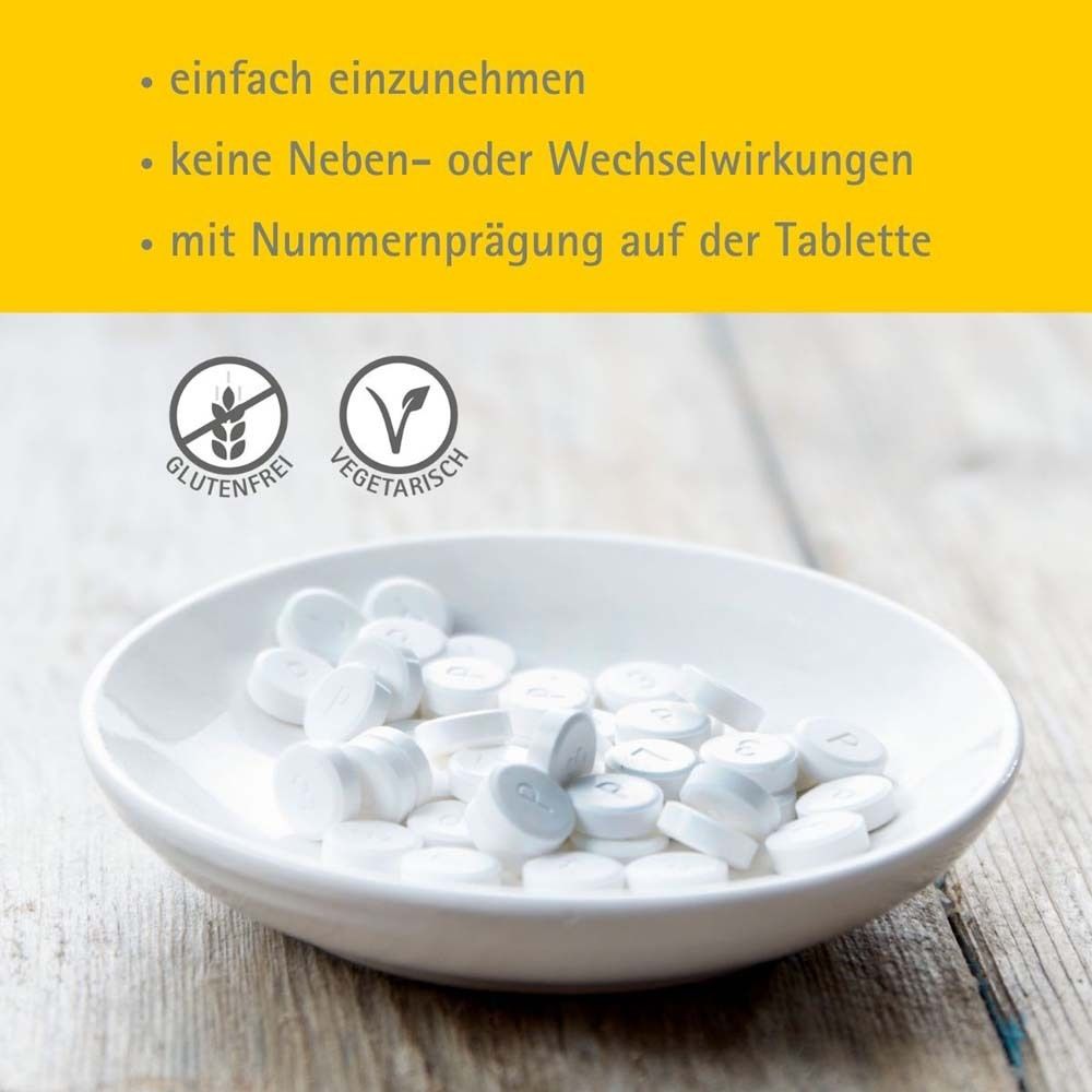 Weiße Tabletten in Schale. Text: Glutenfrei, vegetarisch, mit Nummer.