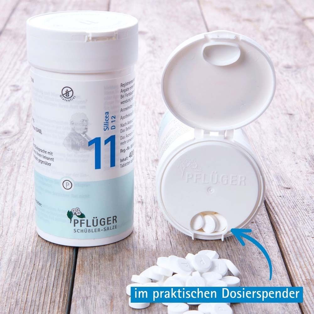 Weißer Zylinder mit Tabletten und Dosierspender. Pflüger Nr. 11 Silicea D12 Tabletten. Tabletten.