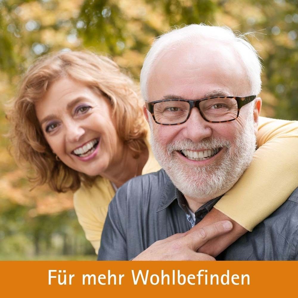 Älteres Paar lächelt. Text: Für mehr Wohlbefinden.