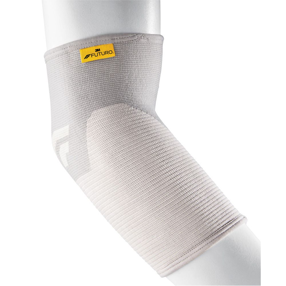FUTURO Comfort Ellenbogen-Bandage, Größe L. Beigefarbene Bandage am Arm, mit gelbem FUTURO-Logo.