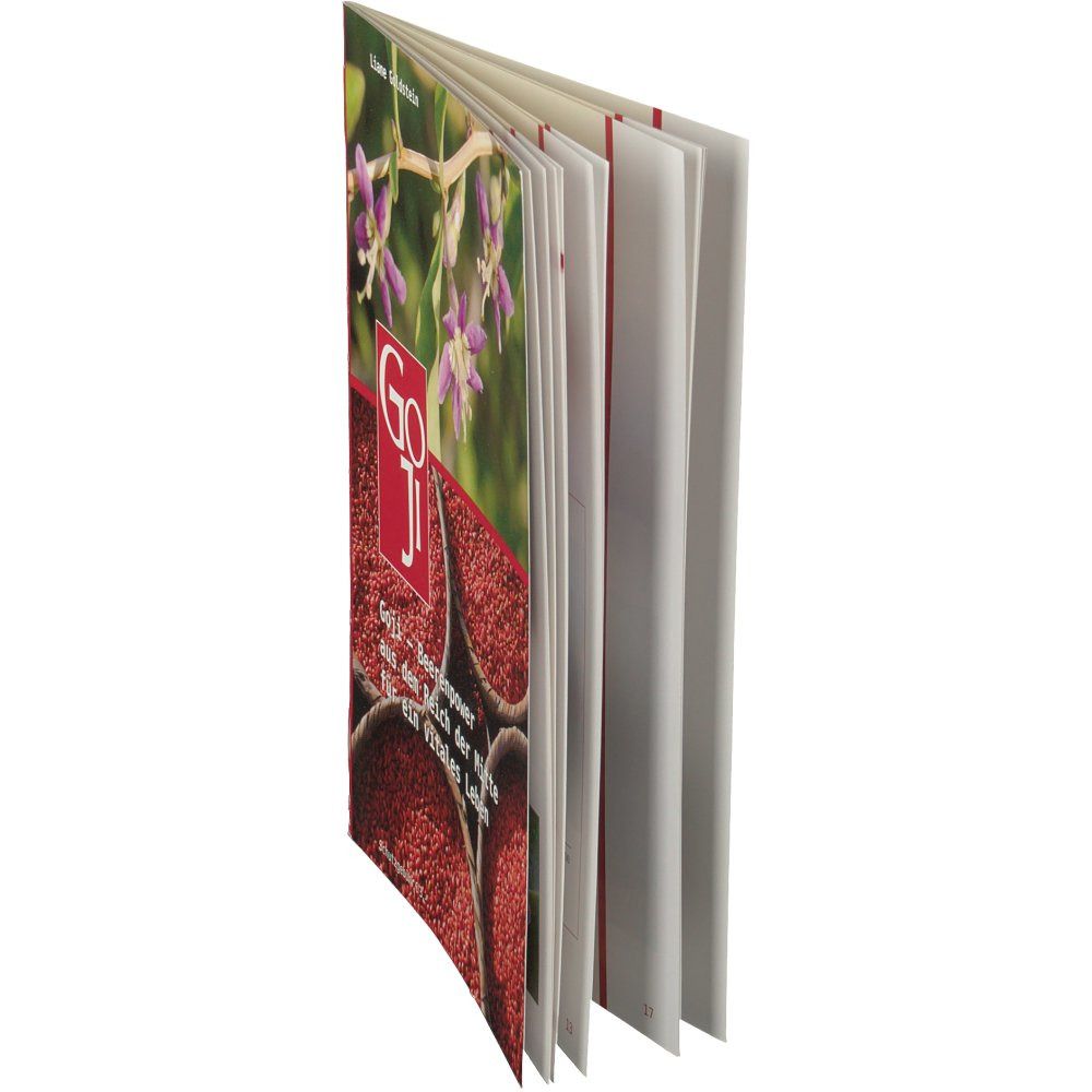 Buch, rote Einbandkante. Titel: Goji. Abbildung von Goji-Beeren und Blüten. Geöffnet, Seiten sichtbar.