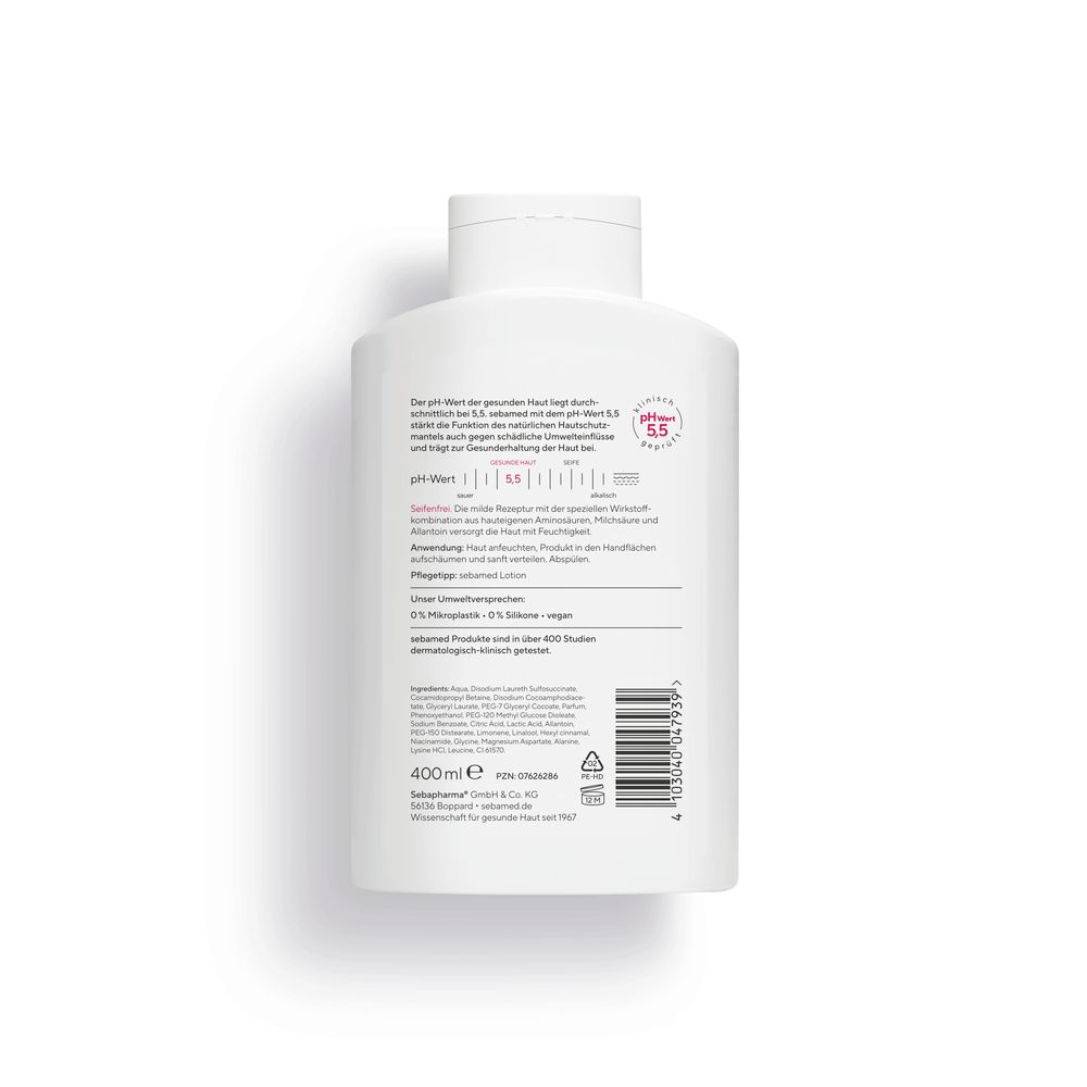 Rückseite der weißen Flasche. Text in deutscher Sprache. Enthält Informationen zum Produkt.