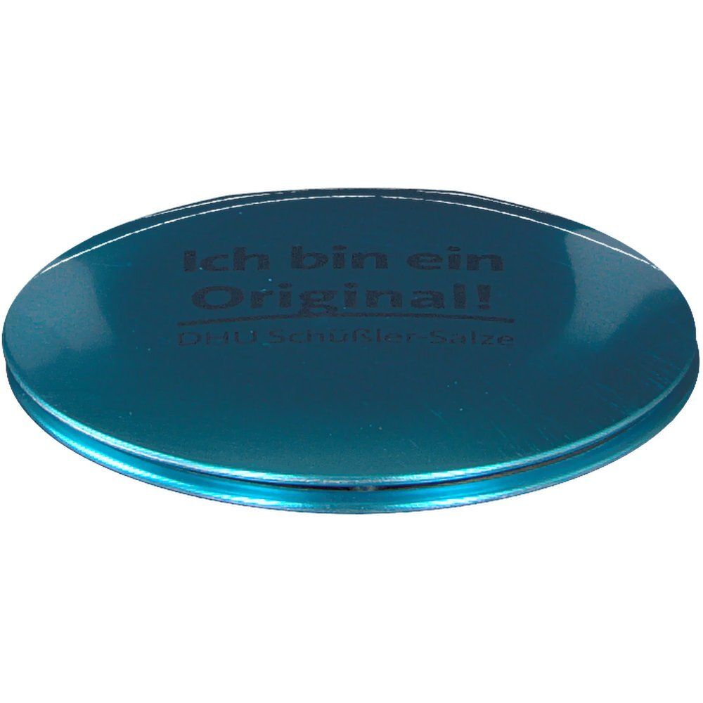 Runder, blauer Kosmetikspiegel. Aufschrift: Ich bin ein Original! DHU Schüßler Salze.