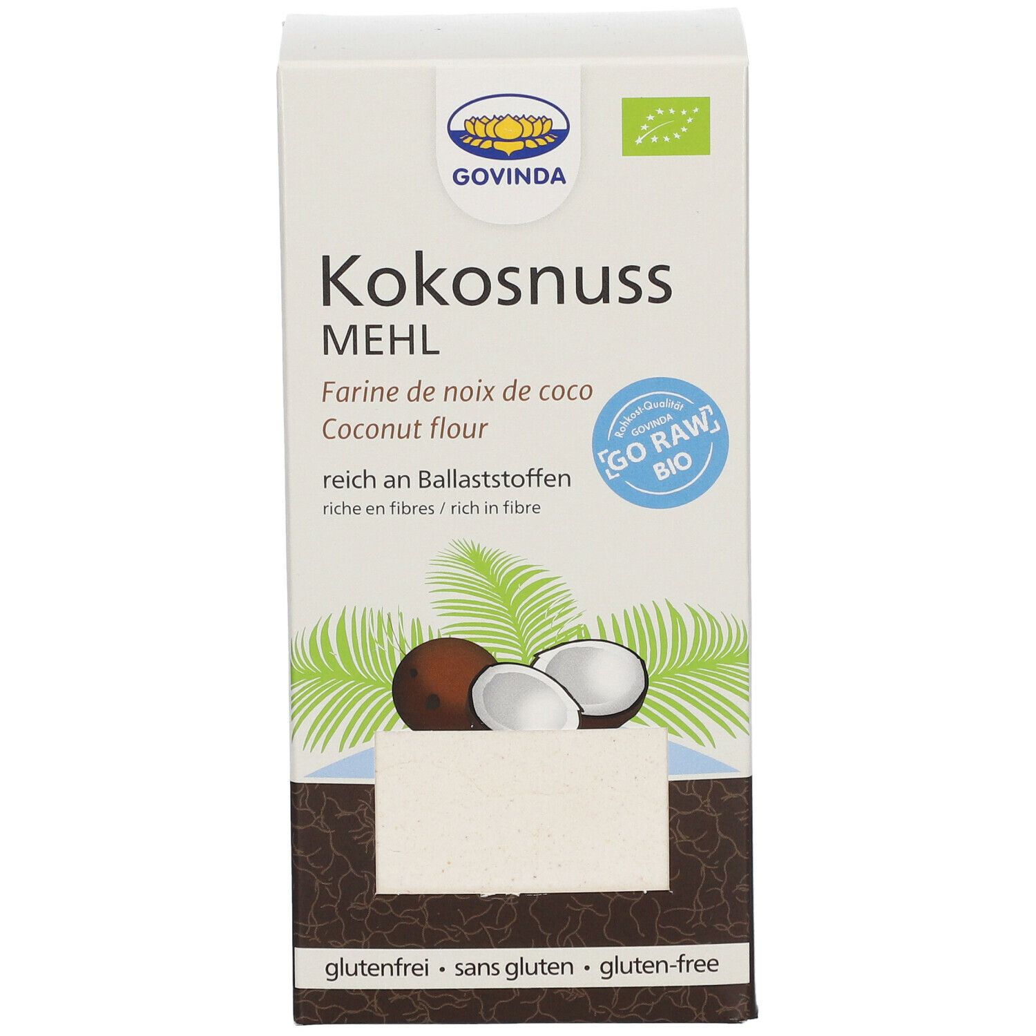 Karton mit Kokosnussmehl. Aufschrift: GOVINDA, Kokosnussmehl, glutenfrei. Abbildung von Kokosnuss und Blättern.