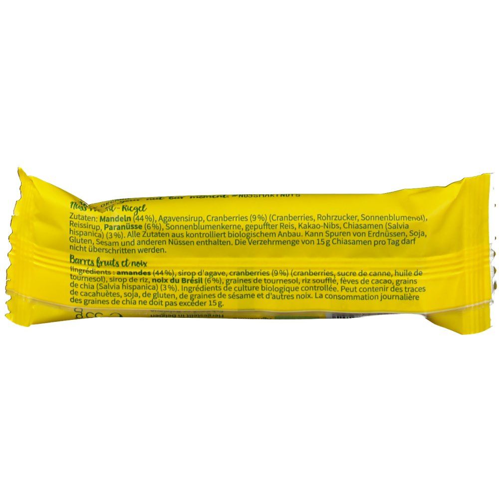 Barre emballée jaune avec liste d'ingrédients. Contient amandes, canneberges, graines de chia et autres. Texte en allemand et français.