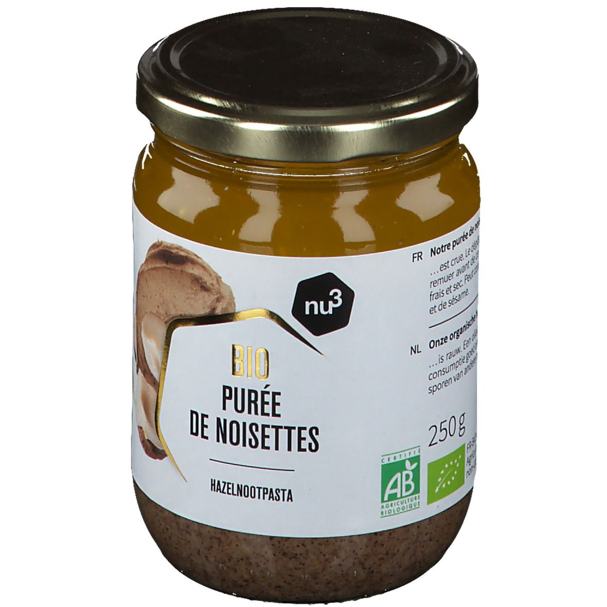 Pot de purée de noisettes. Étiquette avec nom du produit, marque et label bio. Illustration de noisettes.