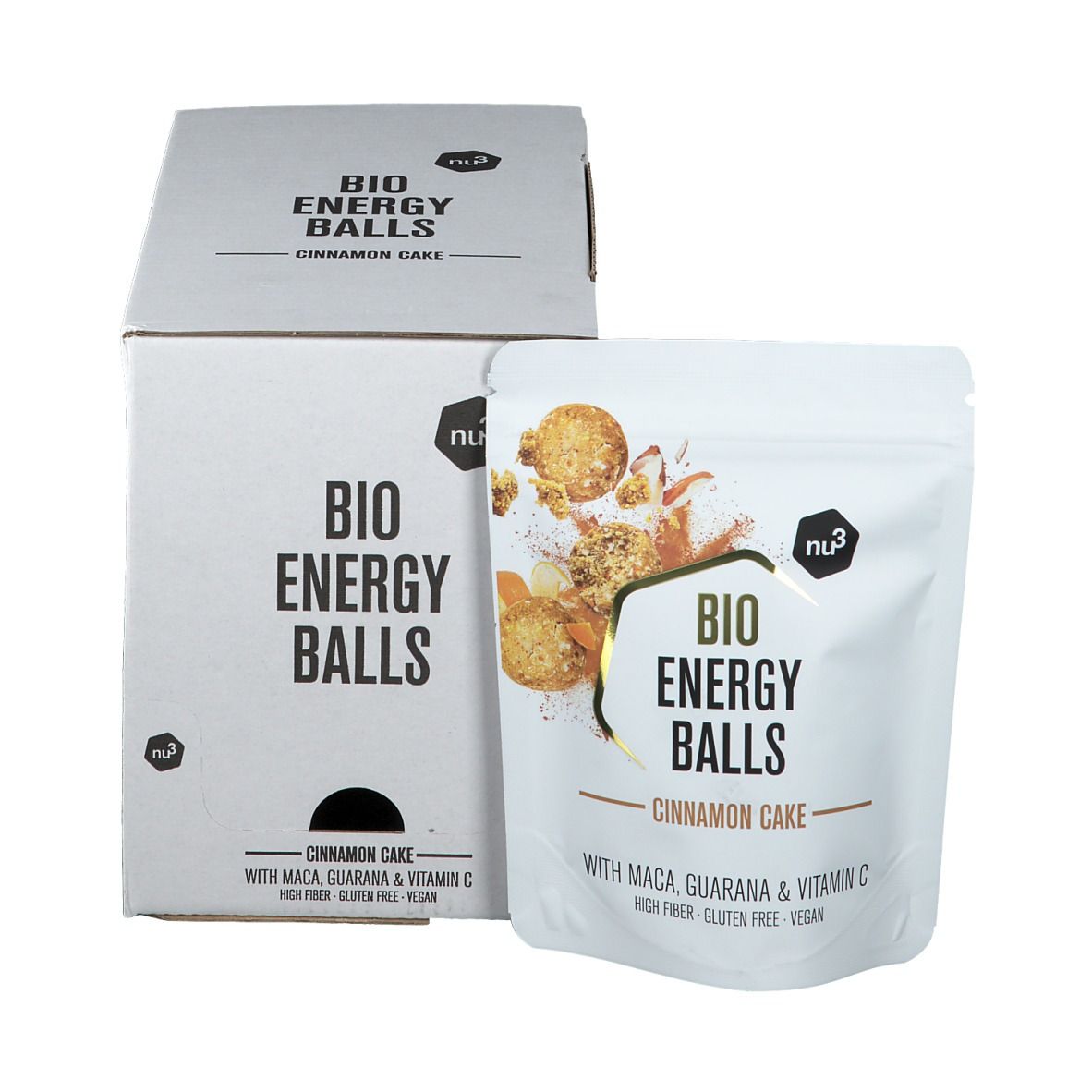 Emballage du produit avec "BIO ENERGY BALLS Cinnamon Cake". Inscriptions avec nom du produit, ingrédients et logo. Emballage blanc avec illustration du produit.