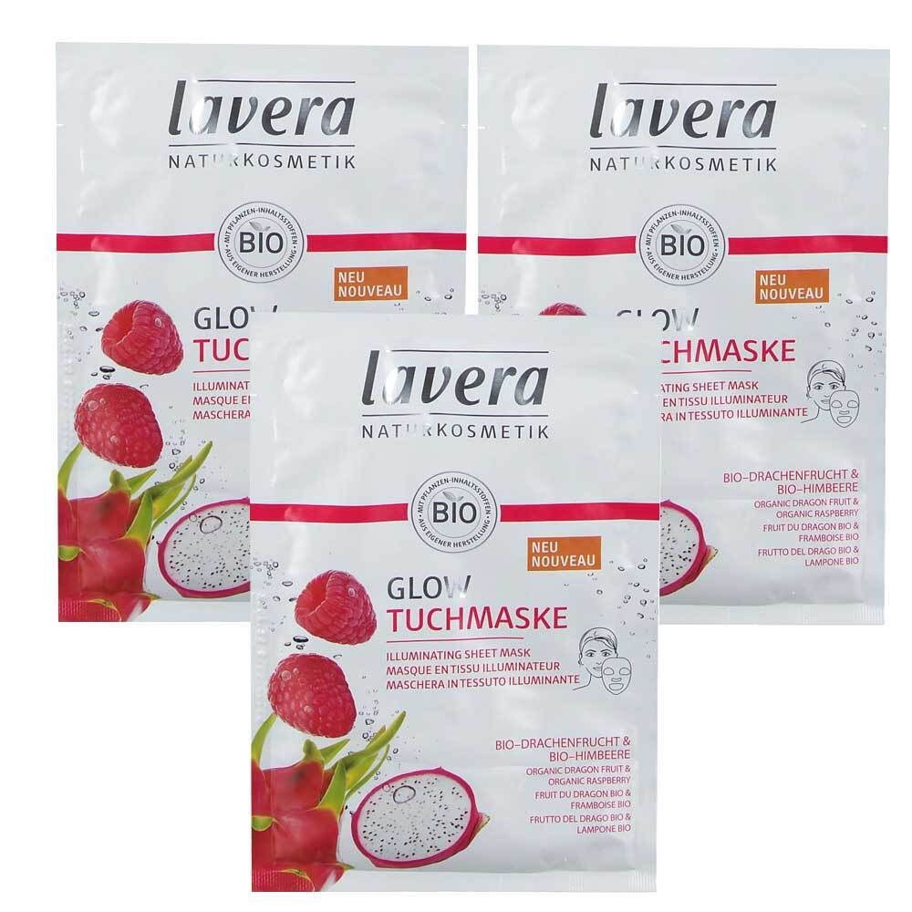 Drei Packungen Lavera Glow Tuchmaske. Weiße Verpackung mit Logo, Bio-Siegel und Produktbezeichnung. Abbildung von Drachenfrucht und Himbeere.