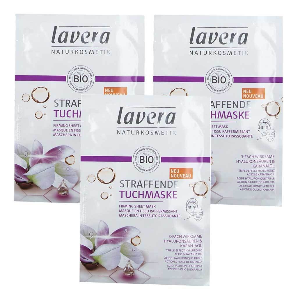 Drei Packungen Lavera Straffende Tuchmaske. Weiße Verpackung mit lila Akzenten, Bio-Siegel und Produktbezeichnung.