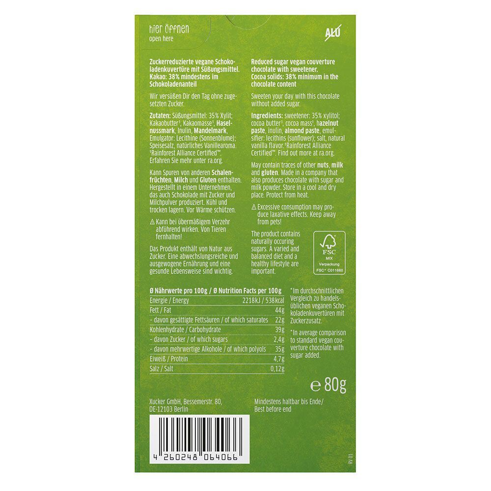 Rückseite der grünen Verpackung. Text in Deutsch und Englisch. Enthält Nährwertangaben, Zutatenliste und Vegan-Siegel. FSC-Zertifizierung.
