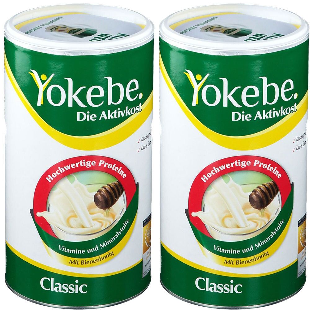 Zwei Dosen Yokebe Classic. Aufschrift: Yokebe, Die Aktivkost, Hochwertige Proteine, Vitamine und Mineralstoffe, Mit Bienenhonig. Dose mit grünem Deckel.