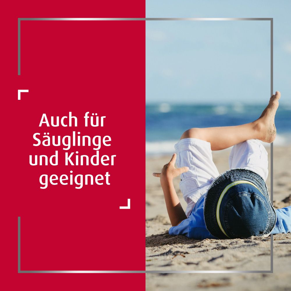 Text: Auch für Säuglinge und Kinder geeignet. Kind liegt am Strand.