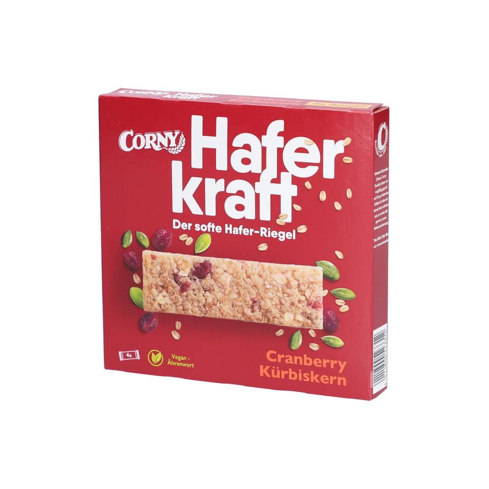 Rote Verpackung mit einem Haferriegel. Aufschrift: Corny Haferkraft Cranberry-Kürbiskern. Vegan.